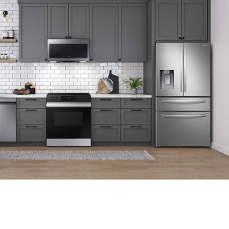 a stainless steel washer and dryer in a kitchen