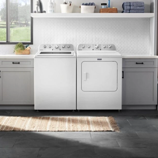 a kitchen with a stove and oven